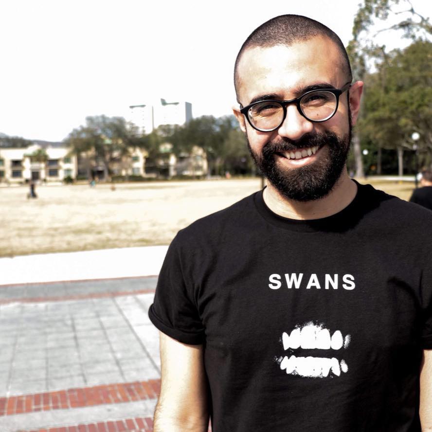 profile picture of me, Charpie, wearing a black tee and glasses.